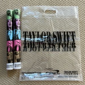 2 Eras Tour glow sticks (never used) and clear merch bag.